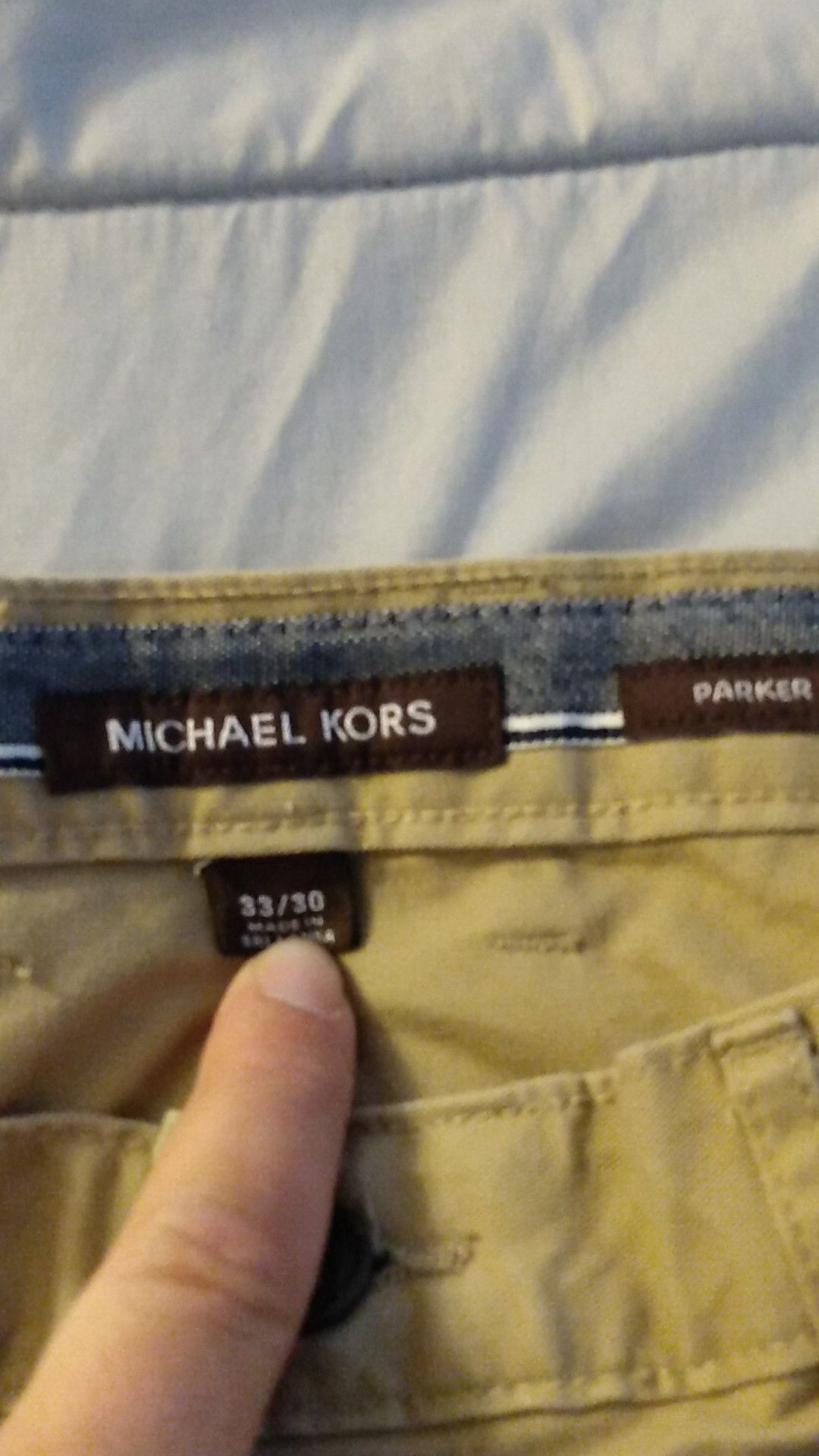 Never warn Michael kors pants tags are of but they haven't Evan bin washed bc they were never used went for $80 they are just to small for me .