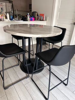 Granite top Dining set must go.