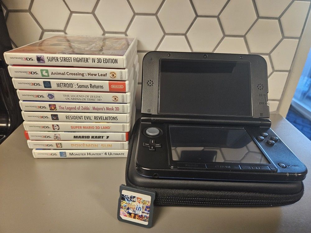 Nintendo 3DS XL with game collection