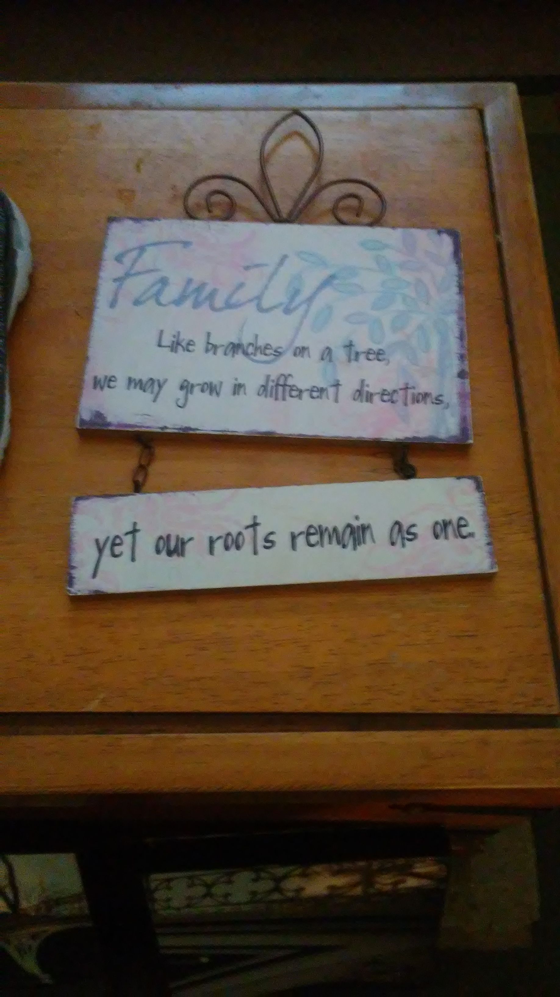 A sign that hangs on the wall