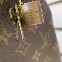 YWCA Yakima - A luxurious Louis Vuitton handbag, complete with