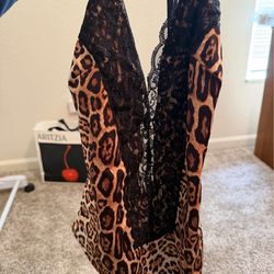 Beautiful one-piece swimsuit with leopard print and black lace detail.