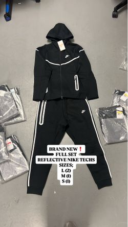 Black Nike tech “reflective”