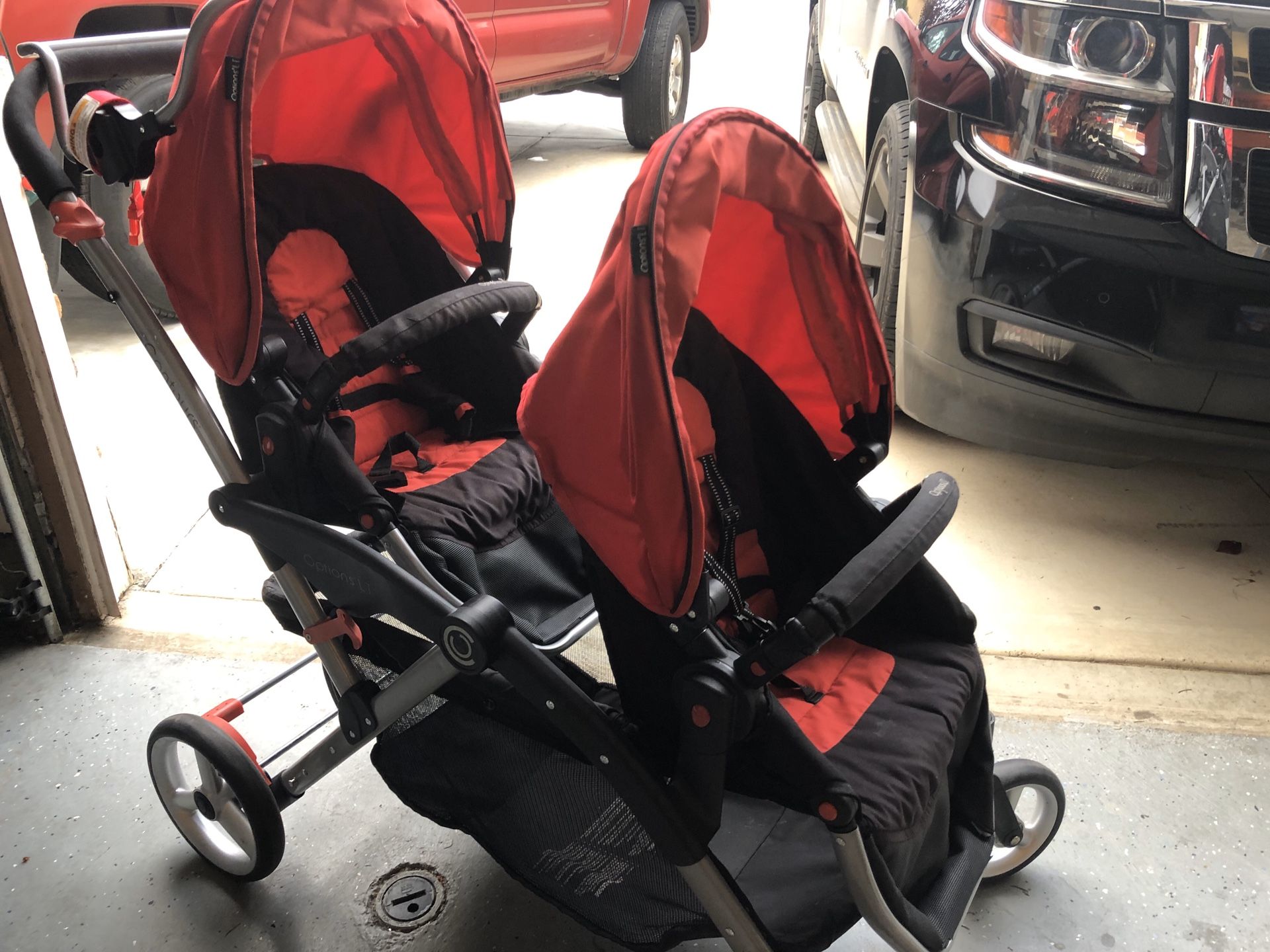 Contour double stroller with interchangeable seats.