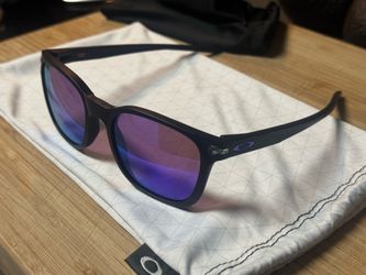 Oakley Ojector prizm purple lens with matching stem emblems.