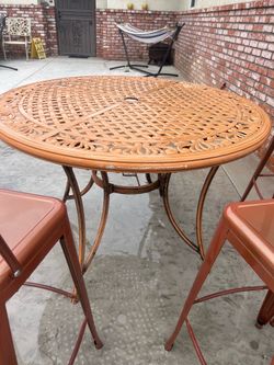 5 metal bar stools and table $1