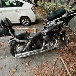 2003 Honda The 2003 Honda Shadow 750 is a cruiser motorcycle with a 745cc v-twin engine, a five-speed transmission, and a low seat height: