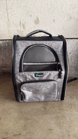 This is a black and gray PetAmi pet carrier.