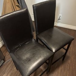 Pair Of Black Metal Cushioned Bar Stools