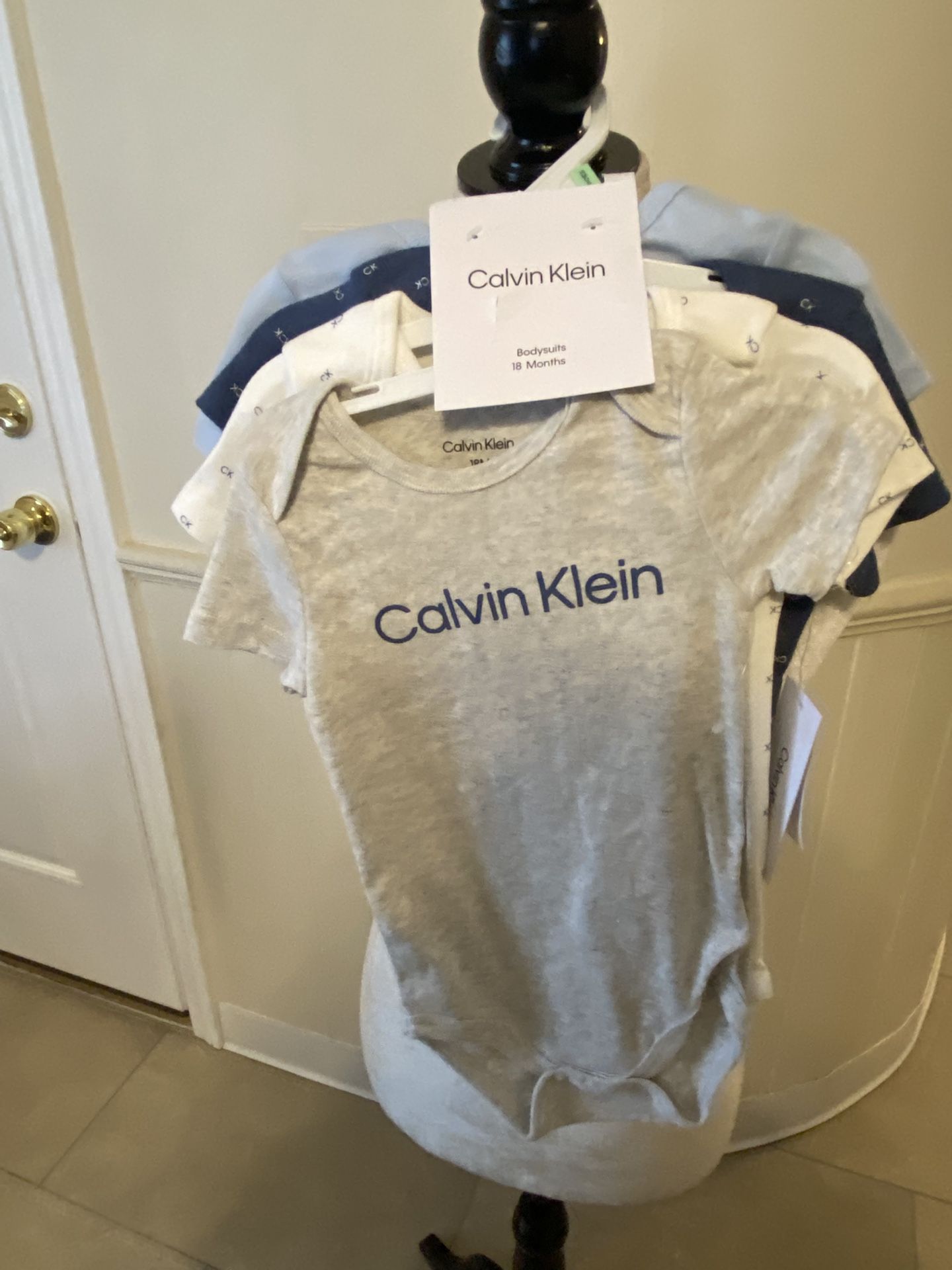 NWT Calvin Klein Four Bodysuits Size 18 Months
