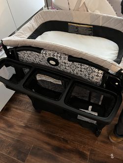 Pack and play with diaper change her bassinet sound machine to separate levels and diaper storage Thumbnail
