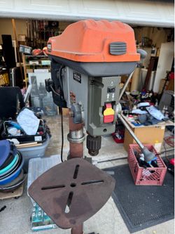 Ridgid standing drill press on rolling base.