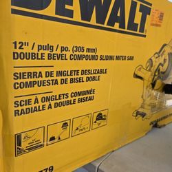 SLIGHTLY USED DEWALT CORDED 12" SLIDING COMPOUND MITER SAW. $335