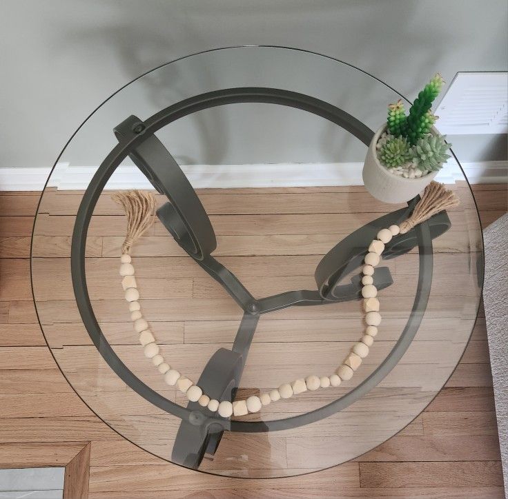 Glass coffee table, 2 side tables, and sofa/console table. Total of 4 pieces.