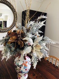 Large ceramic vase with flowers arranged