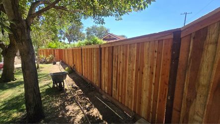 Cap n trim wood fence with board on board