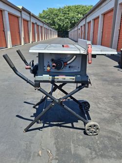 Craftsman 15 amp table saw on portable stand