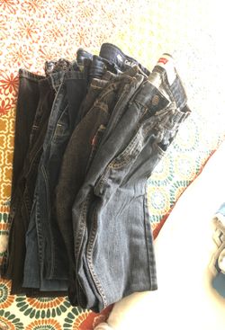 All brand name 7 pair of boys size 16 slim jeans