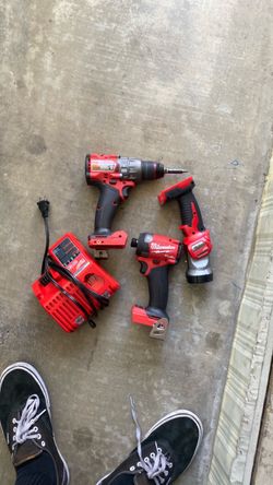 Miluakee fuel impact and drill with charger and flashlight no battery