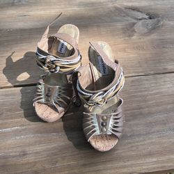 Brown and tan leather wedges with rope detailing and cork sole