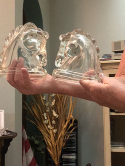 Glass horse head book stops