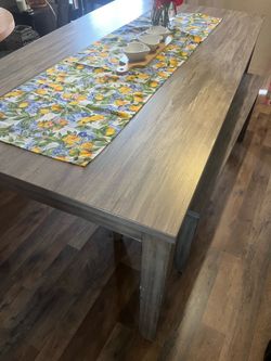 Grey rectangle dining table with bench