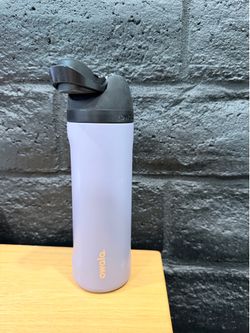 The Owala 24oz FreeSip Stainless Steel Water Bottle in Pastel Purple