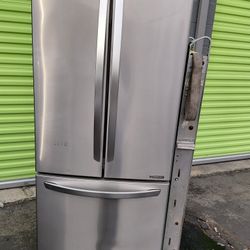 LG brand 30-inch wide 3-door refrigerator