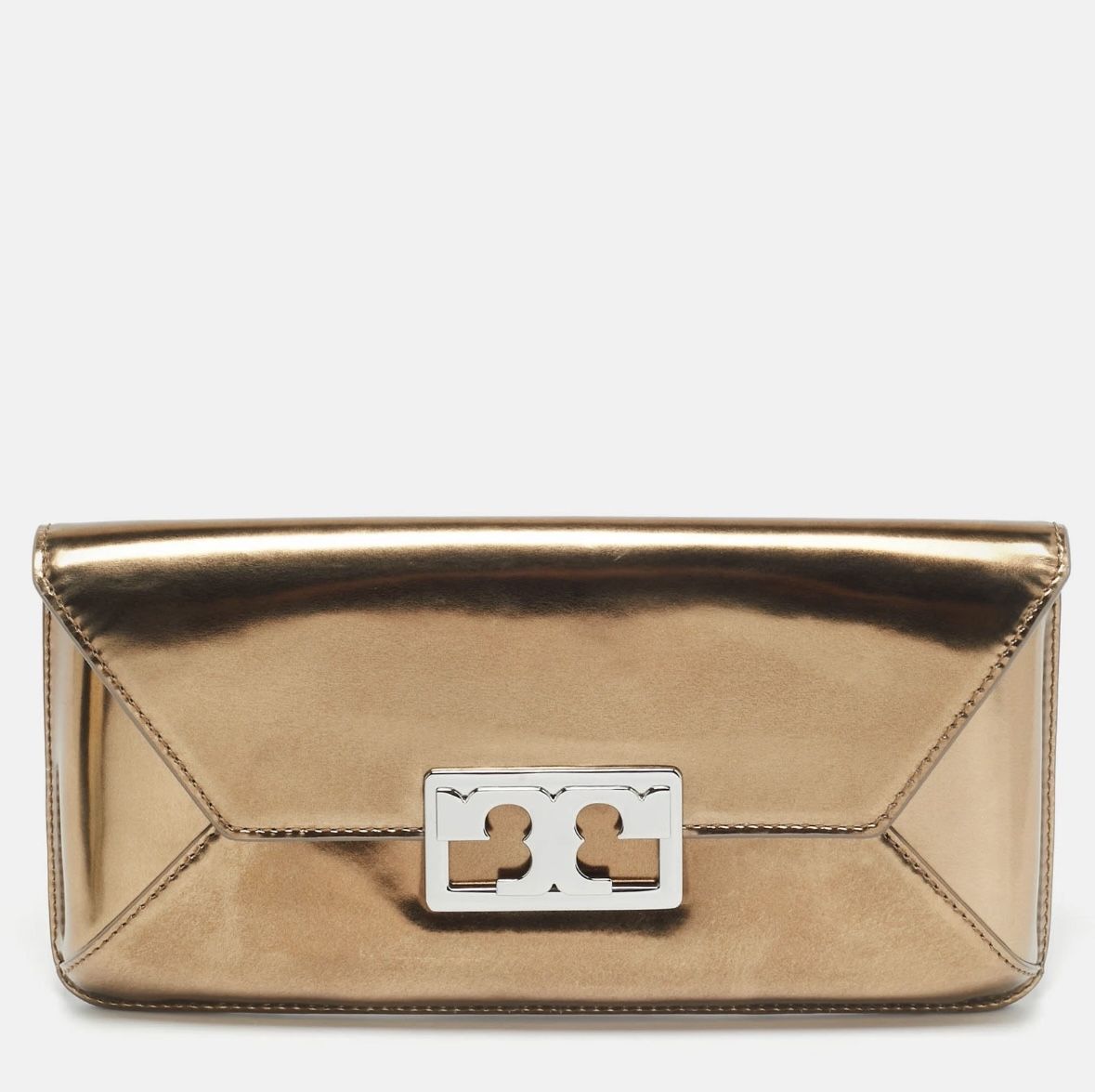 New with tag Comes with dust bag OBO Has some minor dents from moving The Tory Burch Metallic Leather Gigi Clutch is a stylish and elegant accessory f