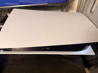 PS5 with controller and cords