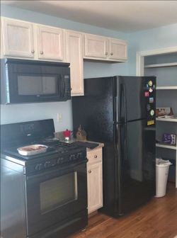 Black like new GE refrigerator freezer upright