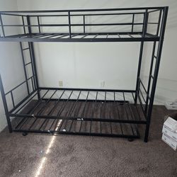 Twin bed bunk bed with roll out frame for 3rd bed