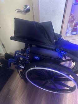 Medical wheelchair folds up super easy nice blue color