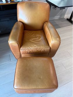Two Leather Chairs + Ottomans