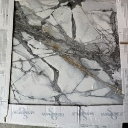 5 Square Ft Of 24by24  Tile Also Four Bags Of Grey Mortor And One Bag Of White