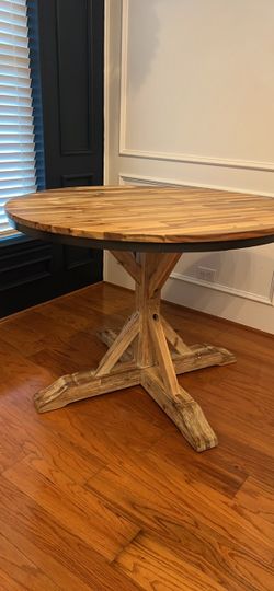 Wood dining table from Sand & Stable/Wayfair