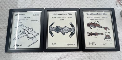 Framed prints of United States design patents for iconic Star Wars vehicles.