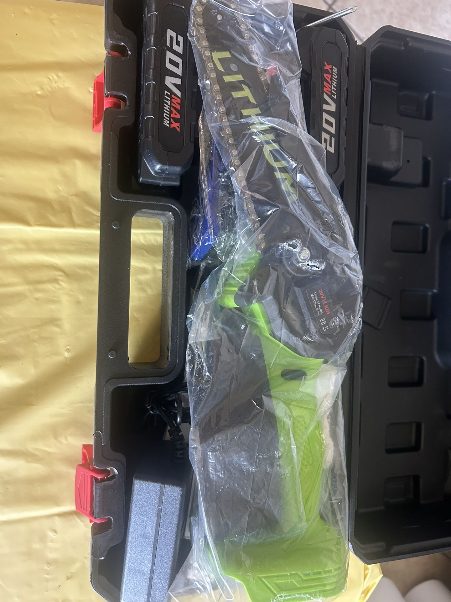 New 6 inches mini lithium chainsaw. It comes with safety, gloves, and safety glasses and a small case.