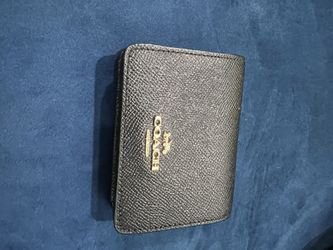 Woman’s Small Coach wallet
