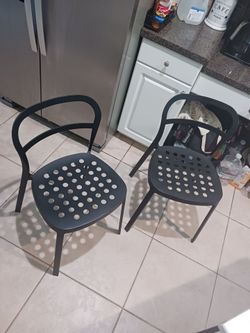 Two black metal chairs