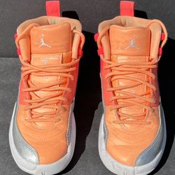 Nike Air Jordan 12 Retro GS ‘Sunrise’ sneakers in Racer Pink, Hot Punch, and Bright Mango colorway.