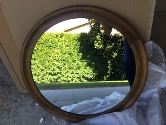 brand new wooden-framed mirror, in original packaging