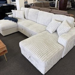 Sleeper sectional with storage and cupholder
