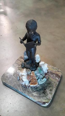 Boy read book sculpture