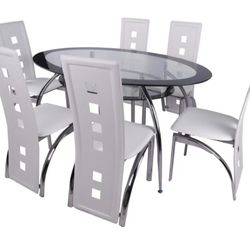 This is a modern dining set featuring a clear oval glass tabletop supported by a chrome-finished base. The set includes six high-back dining chairs wi