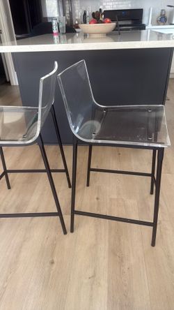 CB2 island high chairs     (chiaro clear acrylic black legs )