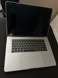 MacBook Pro Laptop (15.6”) W/ Touch Bar