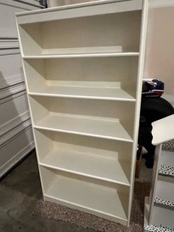 Free bookshelf (Dimensions: 64 by 32 by 10 inches)