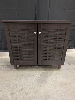 Compact Dark Brown Storage Cabinet with Woven Doors