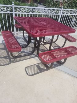Red table with attached benches